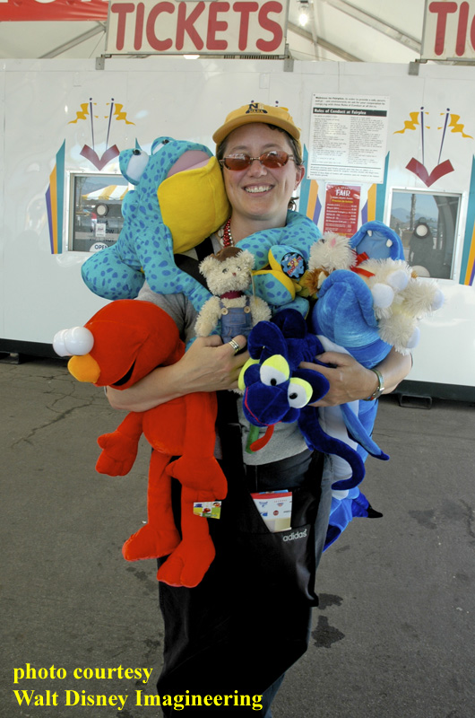 Disney Imagineer Sue Bryan testing out plush prizes from carnival midway games on a research trip to the Los Angeles County Fair