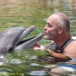 Survivor first winner Richard Hatch meets Dexter the dolphin at Discovery Cove in Orlando