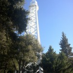 The 150-ft solar observatory tower has a bucket lifted on cables to go to the top.